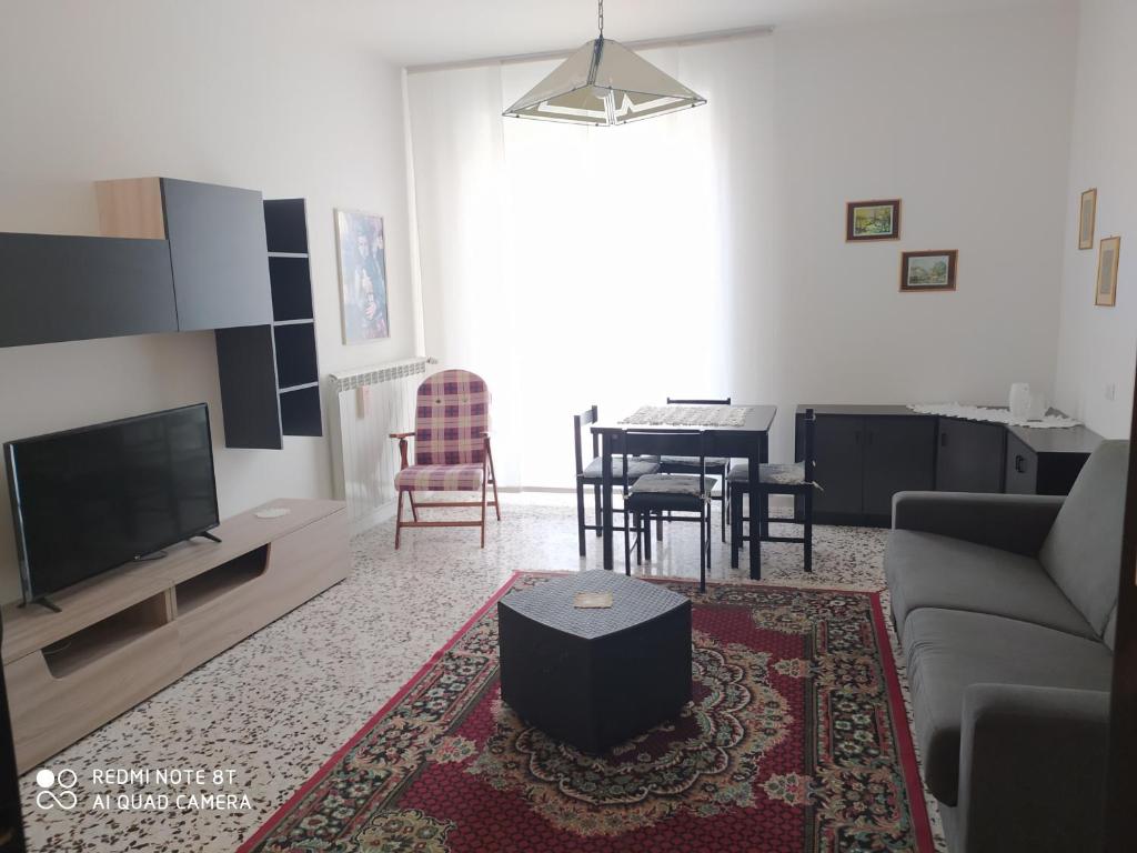 a living room with a couch and a table at Al Cinema in Scerni