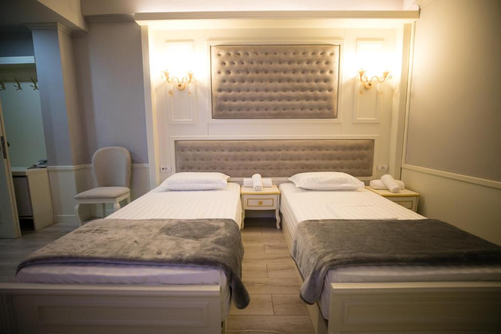 Postel nebo postele na pokoji v ubytování Hotel Lotus