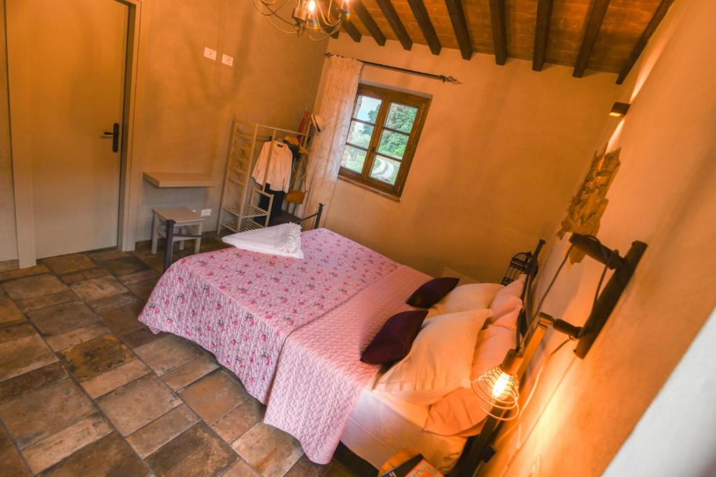 Posteľ alebo postele v izbe v ubytovaní Agriturismo Poggio Ridulfo