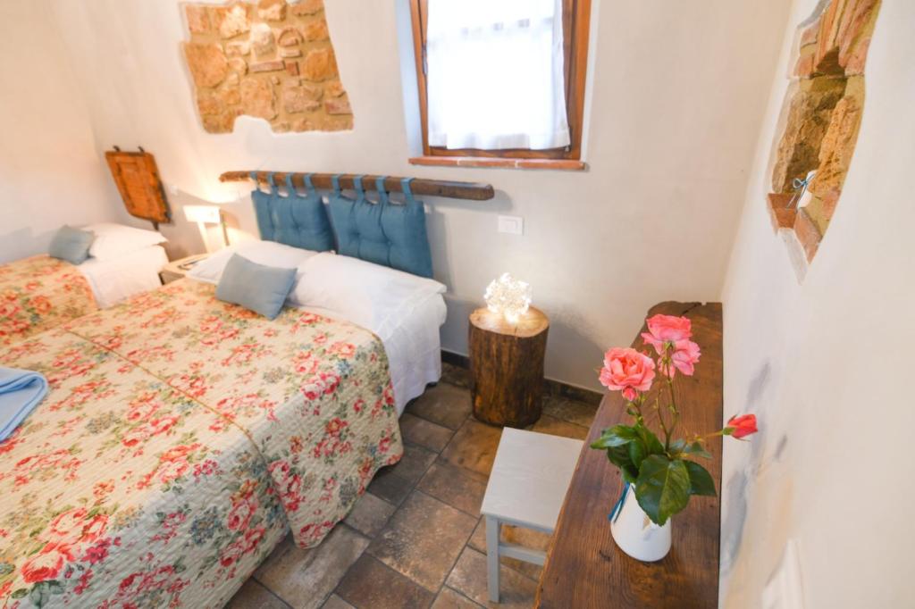 Posteľ alebo postele v izbe v ubytovaní Agriturismo Poggio Ridulfo
