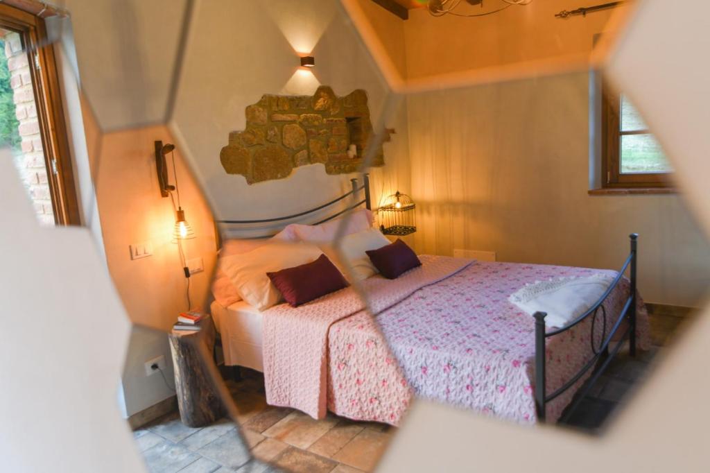 Posteľ alebo postele v izbe v ubytovaní Agriturismo Poggio Ridulfo