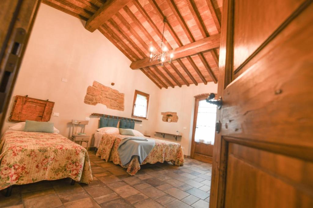 Posteľ alebo postele v izbe v ubytovaní Agriturismo Poggio Ridulfo