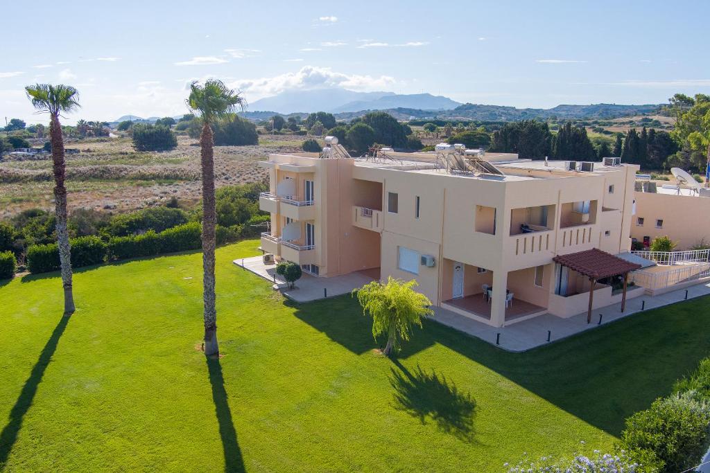 an aerial view of a house with palm trees at Cirillo Family Hotel-Christinas Studios in Mastihari