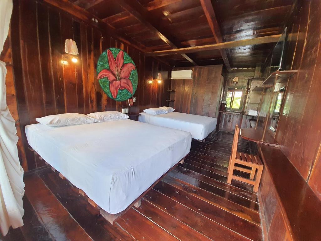 Postel nebo postele na pokoji v ubytování Eco Cabañas Bluekay