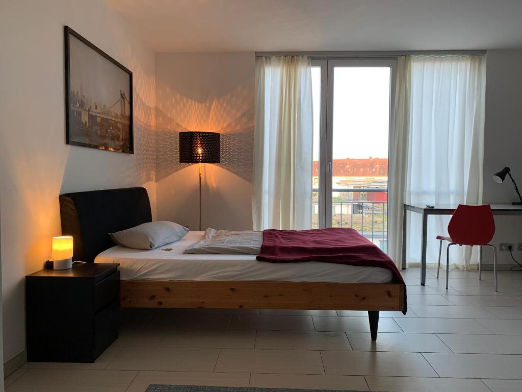 Postelja oz. postelje v sobi nastanitve Gemütliches Apartment by Rabe - Parkplatz & free Netflix & Coffee-Bar