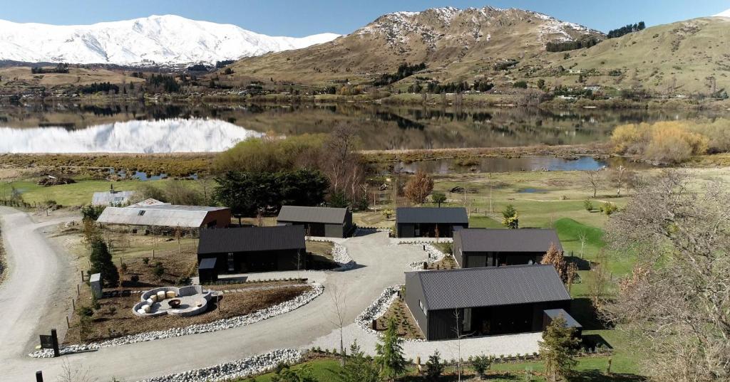 an aerial view of a home with mountains in the background at The Cottages at Lake Hayes in Queenstown