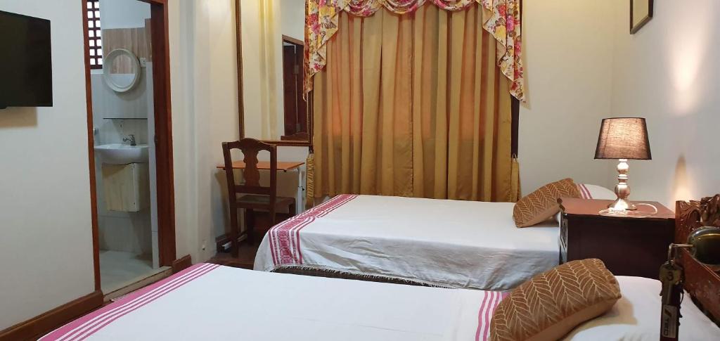 Postel nebo postele na pokoji v ubytování Casa Familya