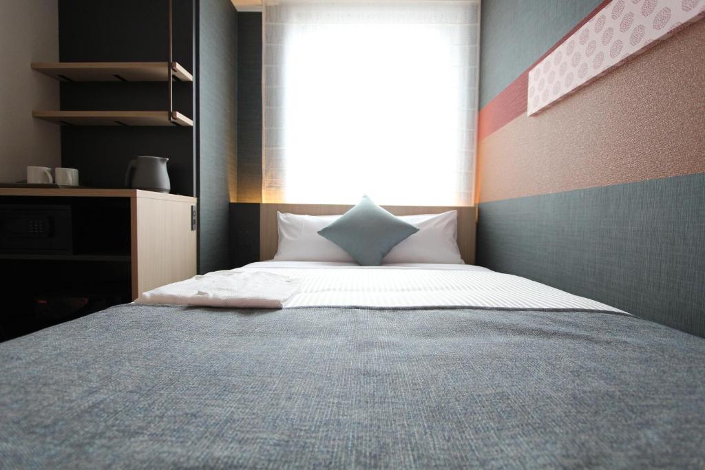 KOKO HOTEL Tsukiji Ginzaにあるベッド