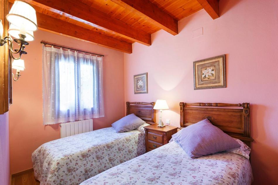 Postel nebo postele na pokoji v ubytování Torres de Vallibierna