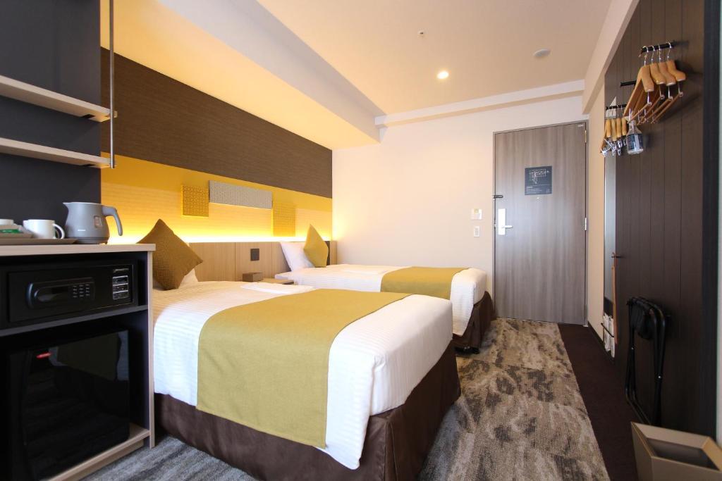 KOKO HOTEL Tsukiji Ginzaにあるベッド