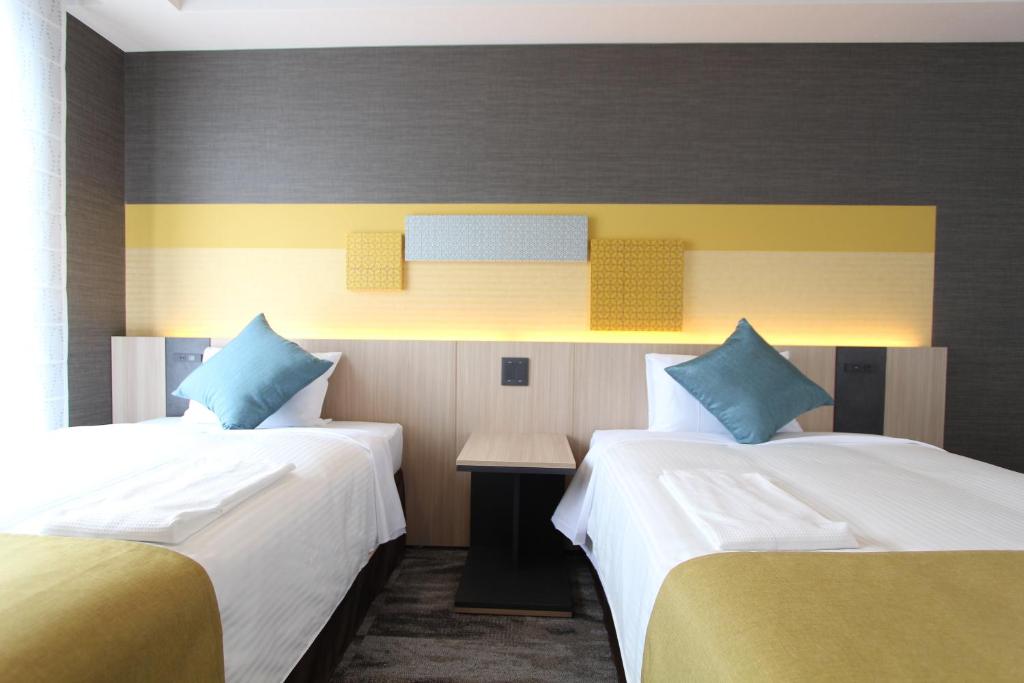KOKO HOTEL Tsukiji Ginzaにあるベッド