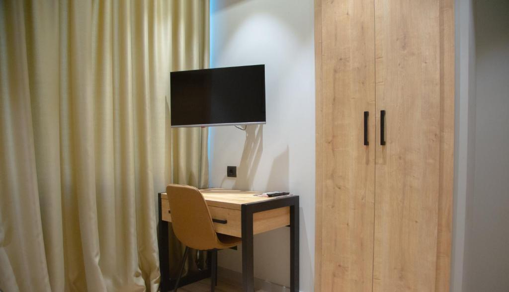 TV a/nebo společenská místnost v ubytování Andor Hotel