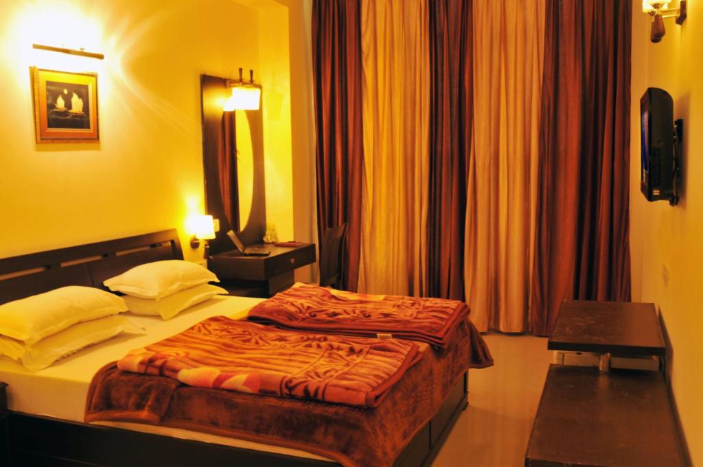 Postel nebo postele na pokoji v ubytování Hotel Hong Kong Inn