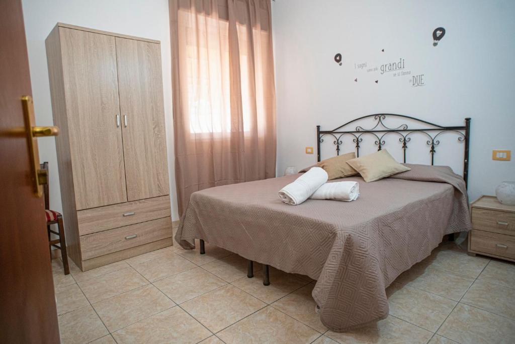 Postel nebo postele na pokoji v ubytování Poesia del Mare B&B