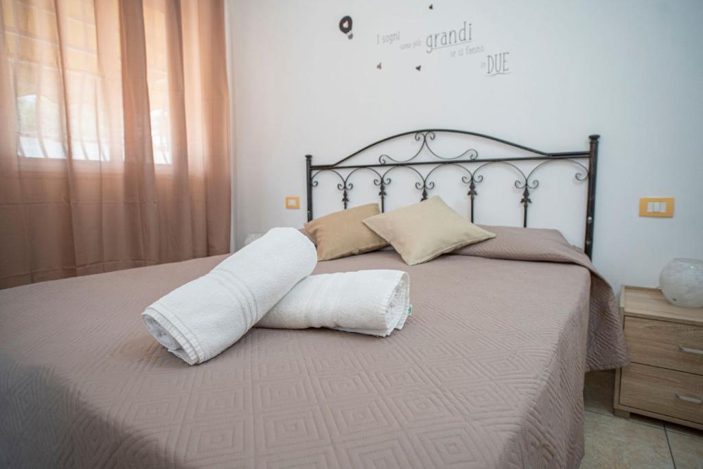 Postel nebo postele na pokoji v ubytování Poesia del Mare B&B
