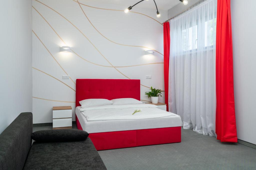 Posteľ alebo postele v izbe v ubytovaní Aquila Hotel