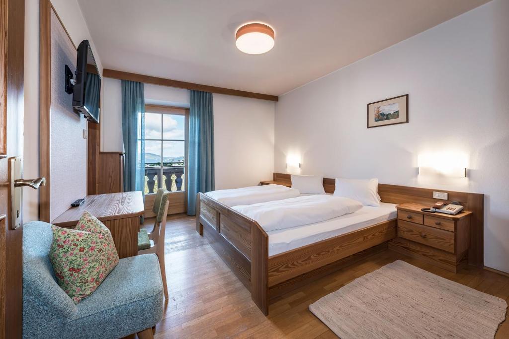 Postel nebo postele na pokoji v ubytování Hotel Bewaller