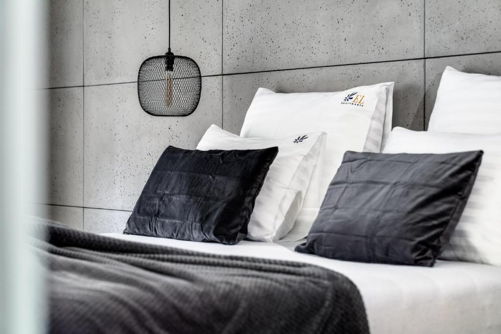 Posteľ alebo postele v izbe v ubytovaní EL Apartments - Lupus