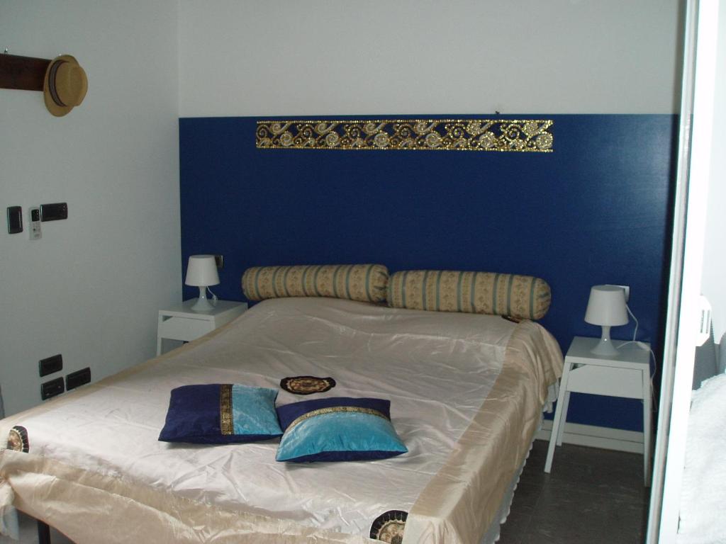 Кровать или кровати в номере Perla B&b