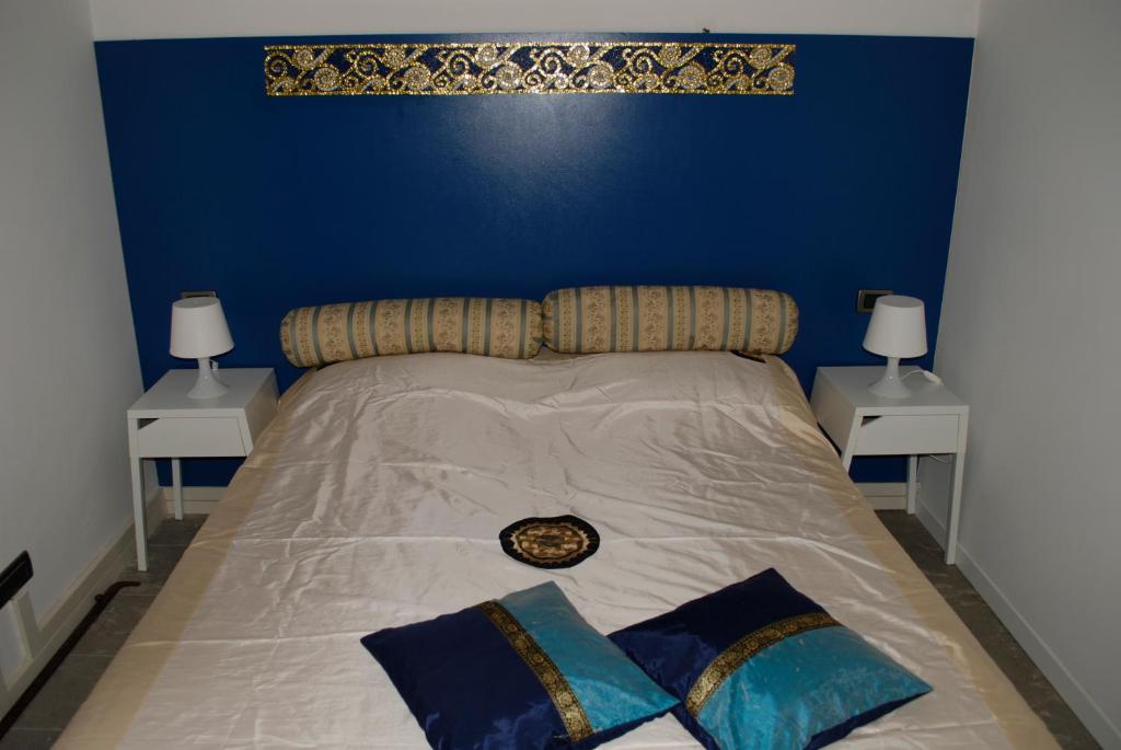 Posteľ alebo postele v izbe v ubytovaní Perla B&b