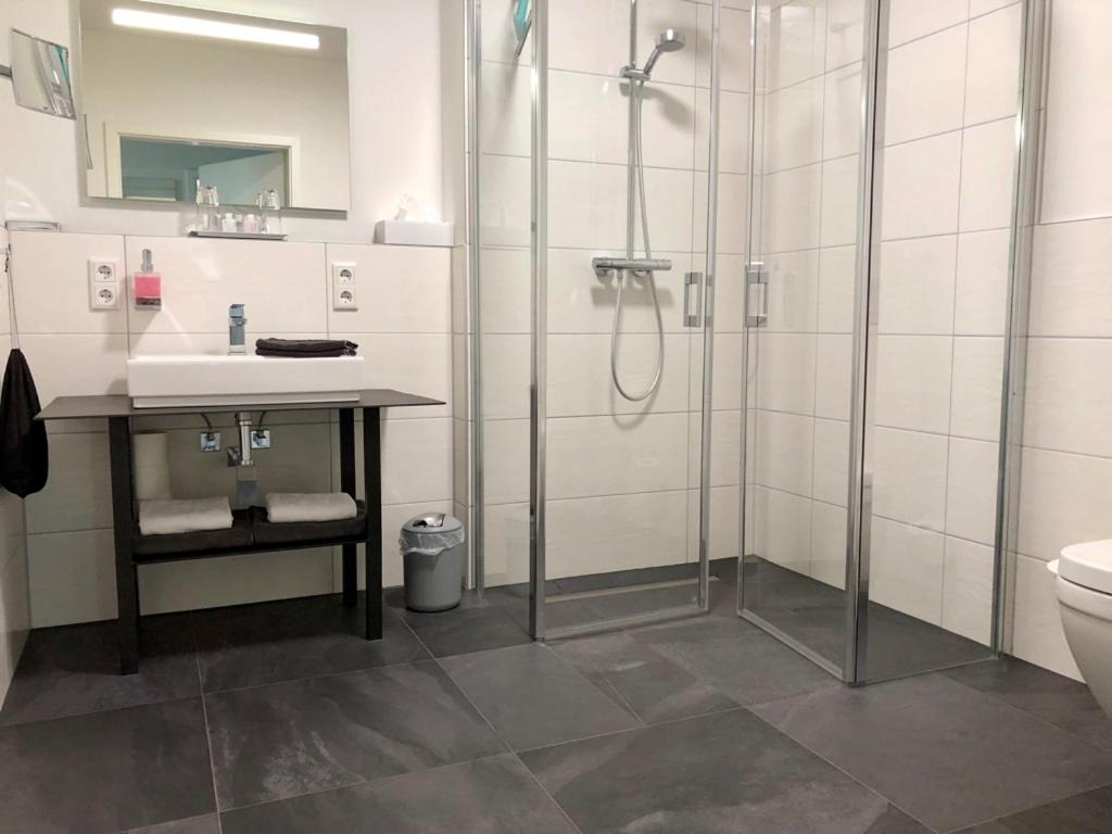 Koupelna v ubytování Appartements an der Golfanlage