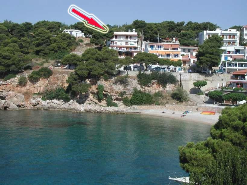 a frisbee flying through the air over a beach at Ethra in Patitiri