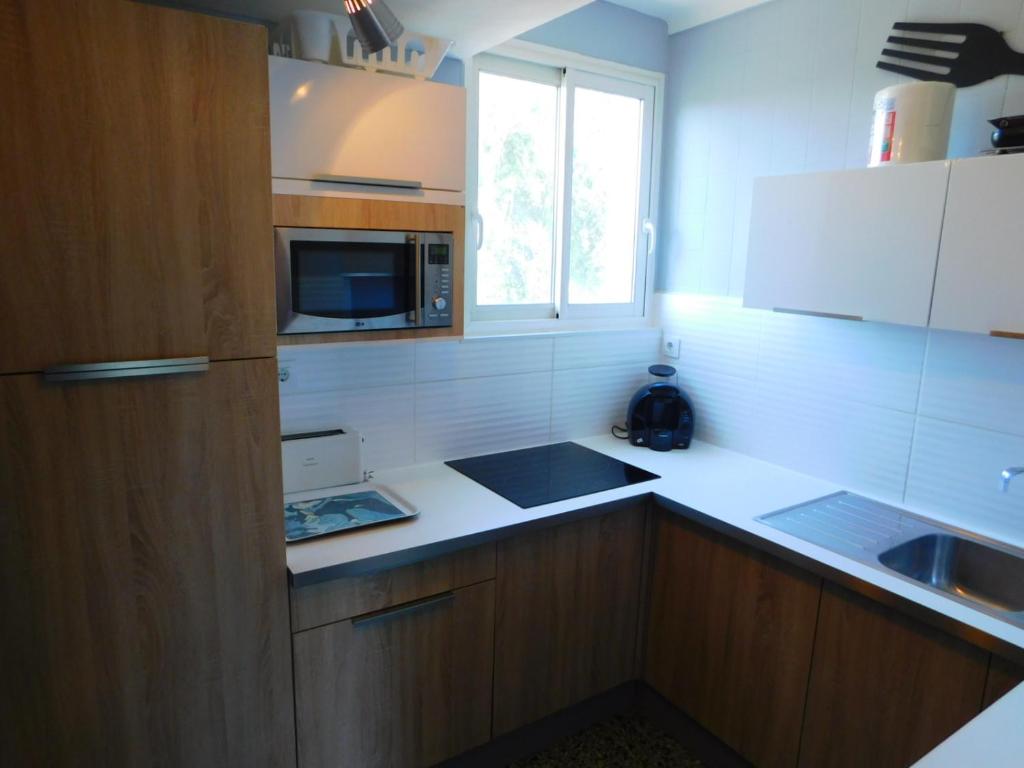 Kuchyňa alebo kuchynka v ubytovaní GMID IMMO Apartamento apartsol