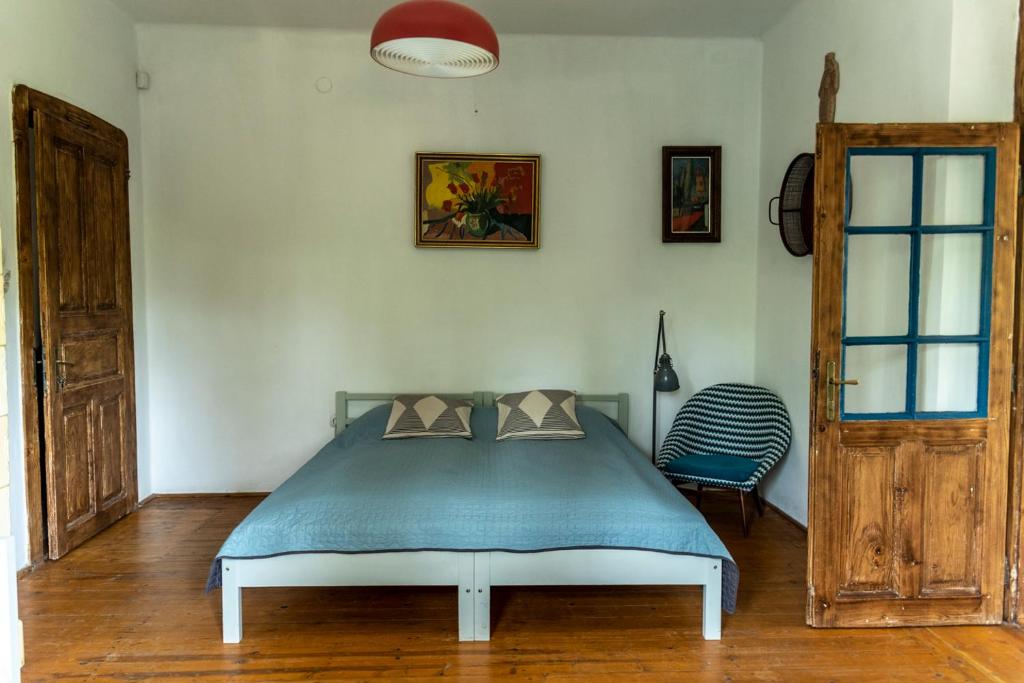 Postel nebo postele na pokoji v ubytování Liget Vendégház