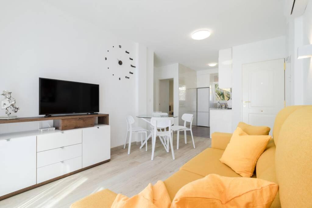 A television and/or entertainment centre at Apartment with pool TORREVISTA ROCIO