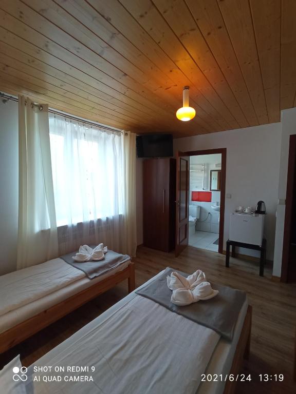 Posteľ alebo postele v izbe v ubytovaní Willa Jacuu