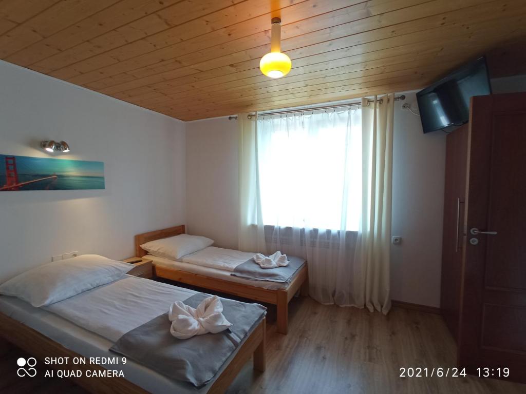 Posteľ alebo postele v izbe v ubytovaní Willa Jacuu