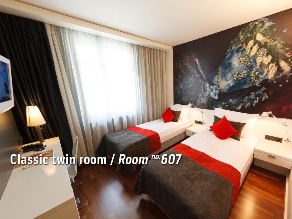 Postel nebo postele na pokoji v ubytování Bohem Art Hotel