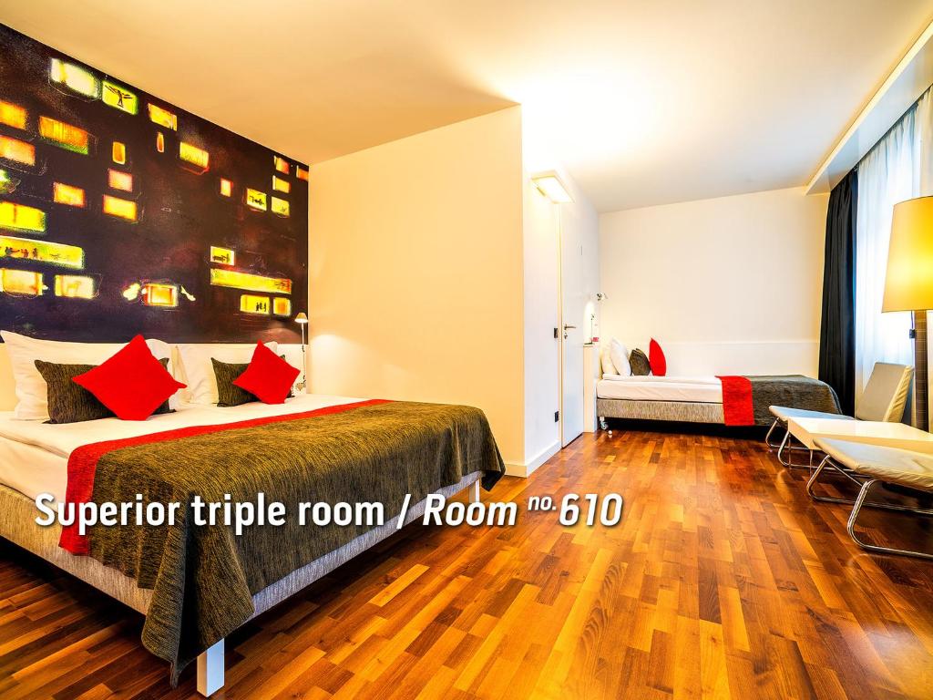 Postel nebo postele na pokoji v ubytování Bohem Art Hotel