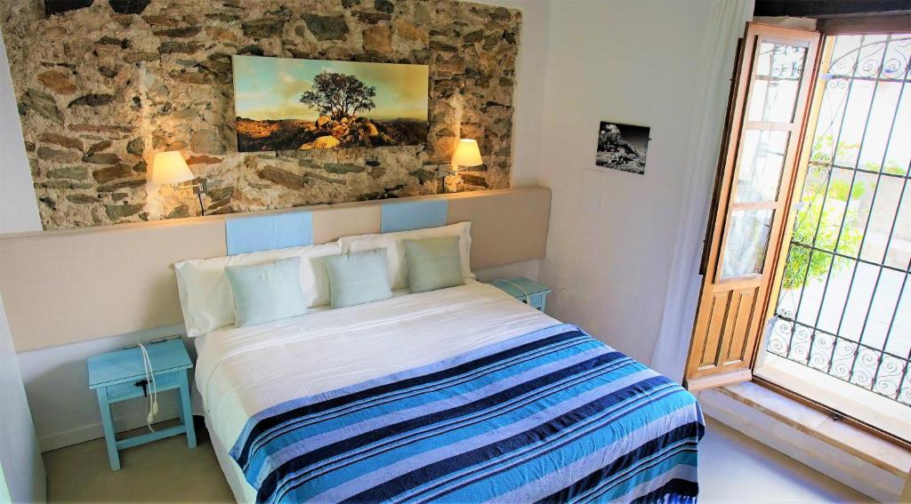 Postel nebo postele na pokoji v ubytování Casona Granado