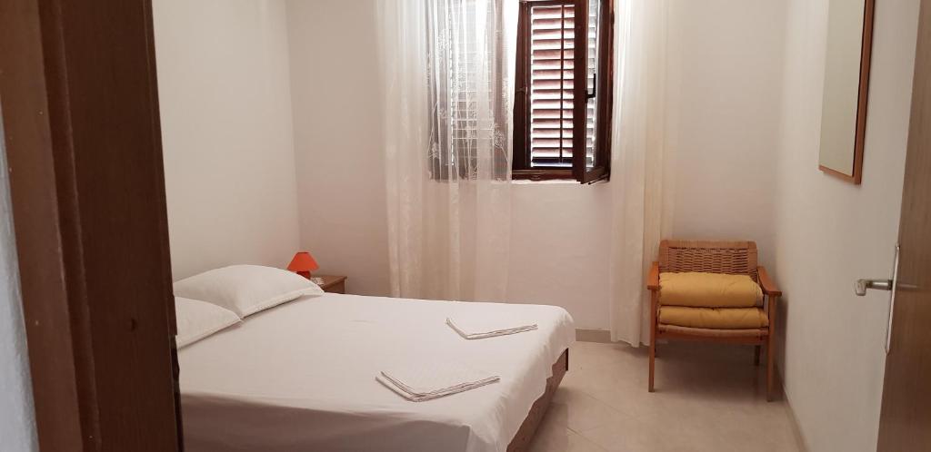 Postel nebo postele na pokoji v ubytování Apartmani Ivanka Simuni