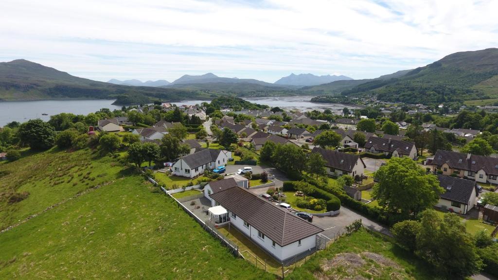 an aerial view of a town with a river and houses at Air Leth Bed & Breakfast in Portree