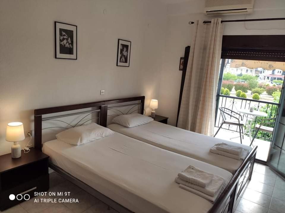 Postel nebo postele na pokoji v ubytování Sivota Rooms Athanasiou