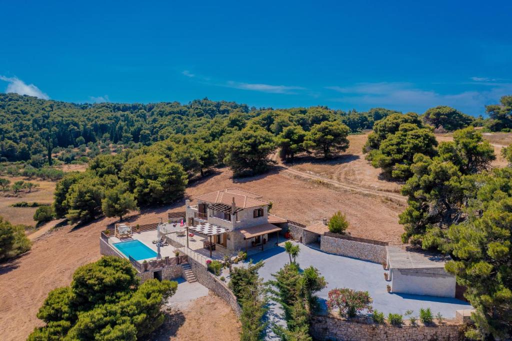 an aerial view of a house with a swimming pool at Villa Navagio Volimes in Volimes