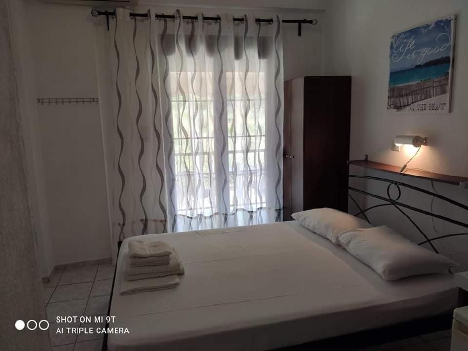 Postel nebo postele na pokoji v ubytování Sivota Rooms Athanasiou
