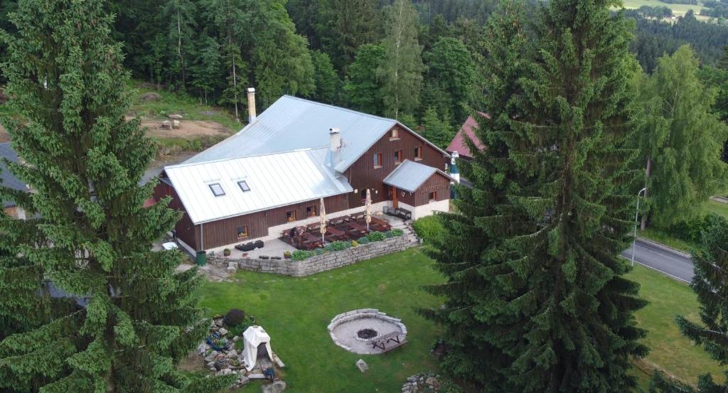 an aerial view of a house in the woods at Penzion Kapitanka in Kořenov