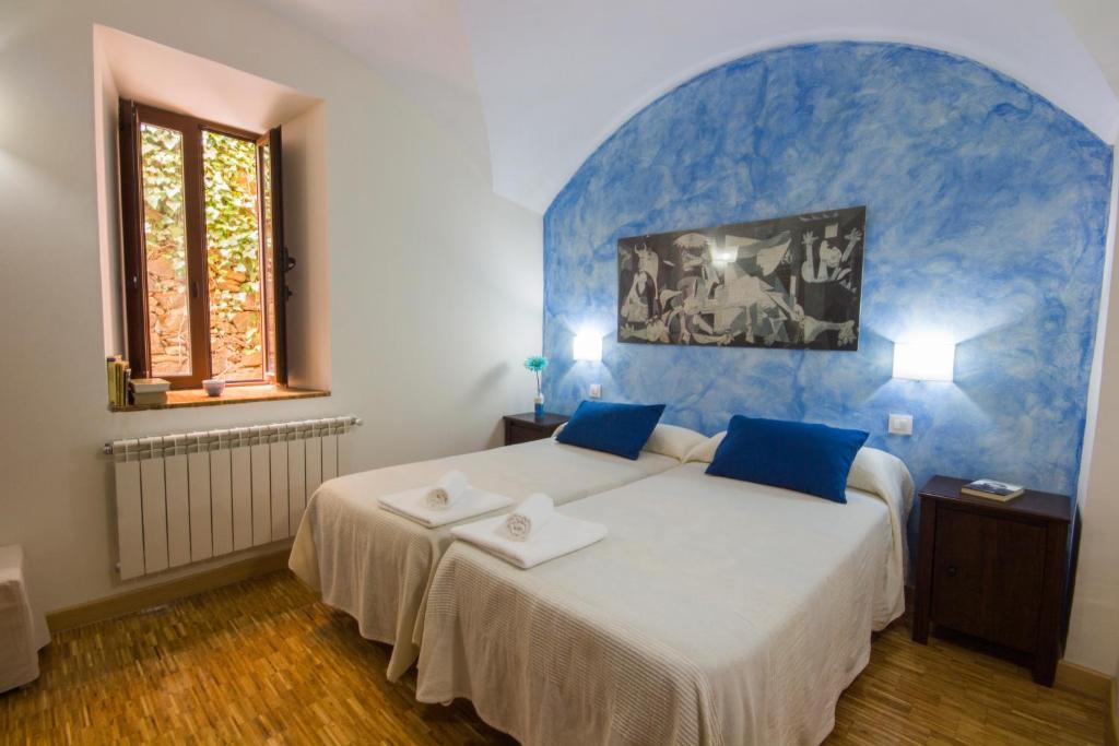 Postel nebo postele na pokoji v ubytování La Posada de Grimaldo