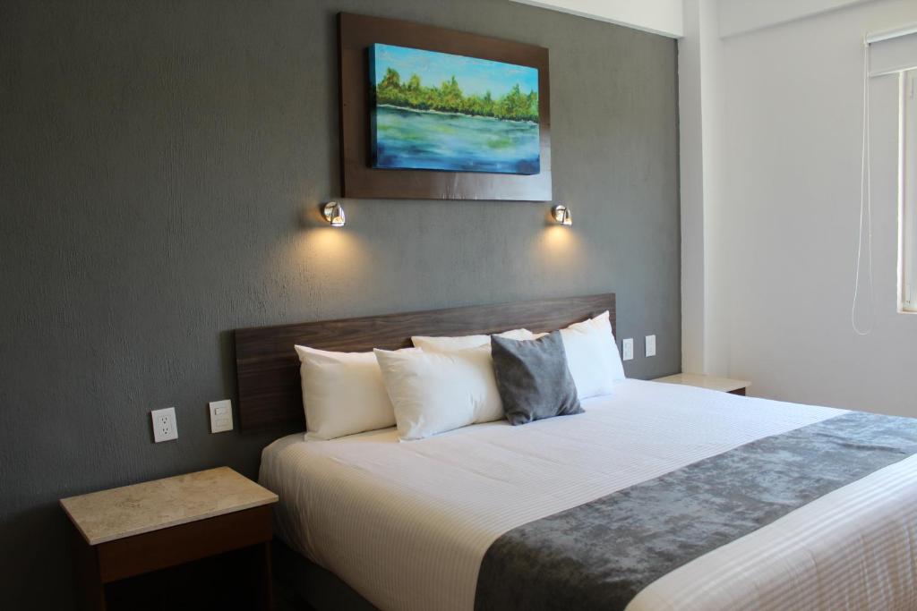 Postel nebo postele na pokoji v ubytování Hoteles Unico Express