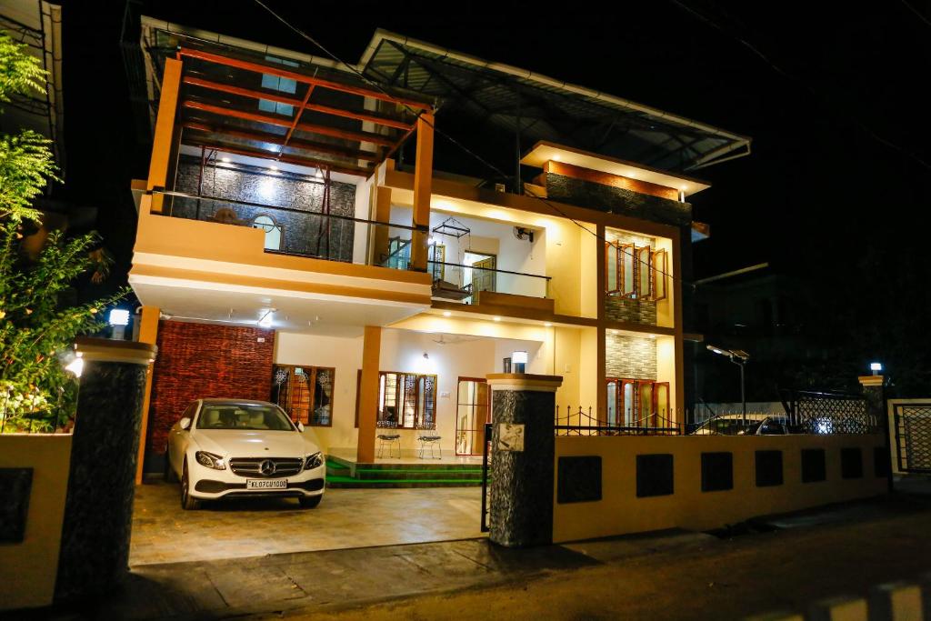 a car parked in front of a house at night at Belljem Homes -your own private resort -3 BHK GF in Trichūr