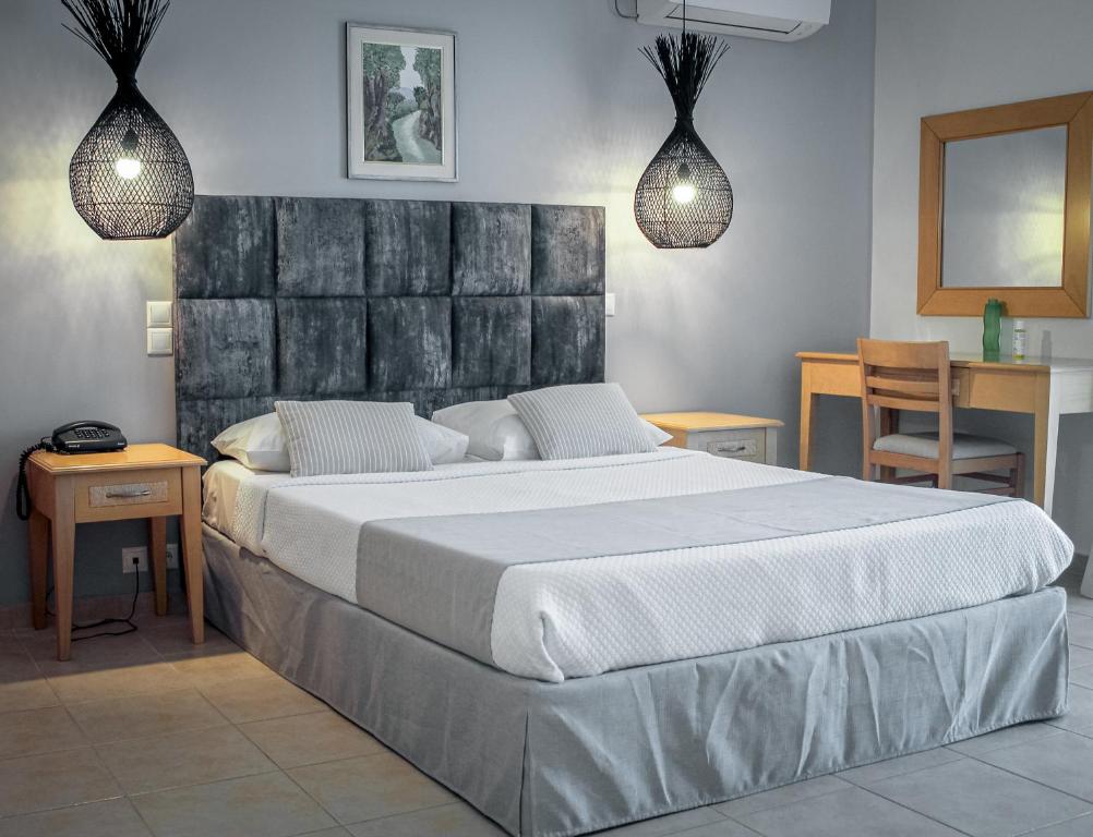 Postel nebo postele na pokoji v ubytování ASTRA Village Resort