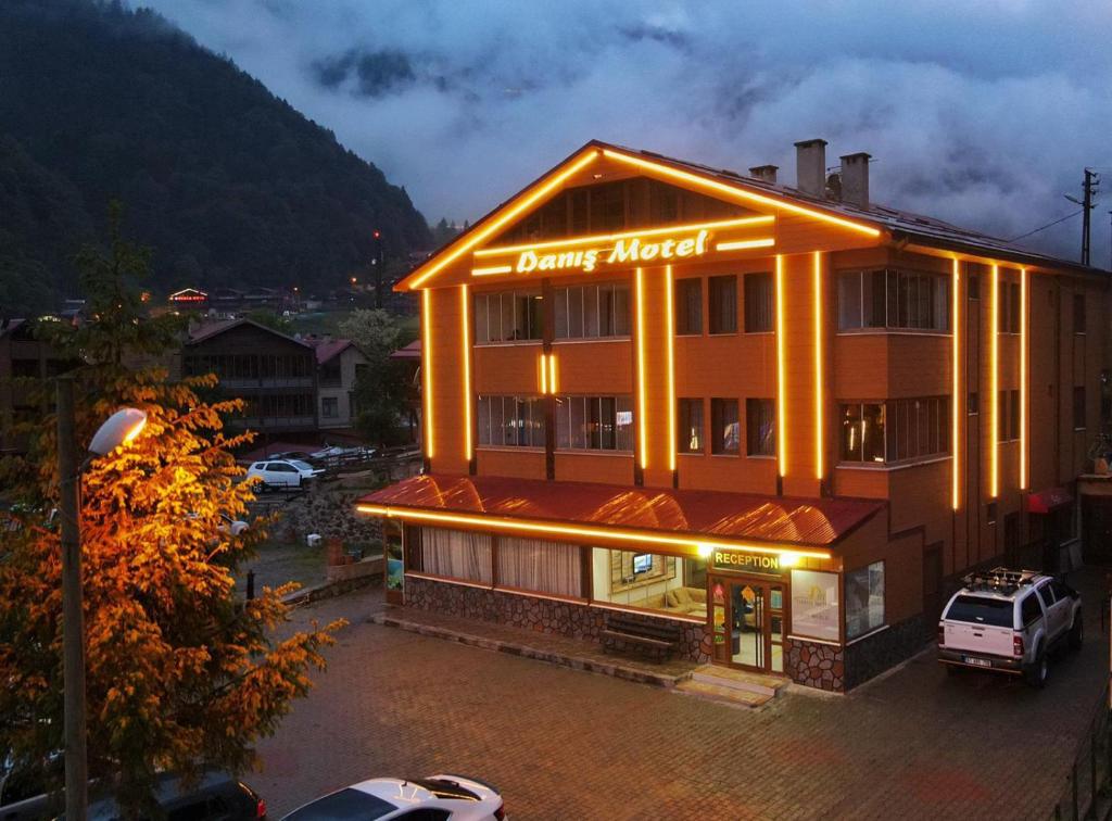 a building with a sign that reads dance attack at Danis Otel Ve Restoran in Uzungol