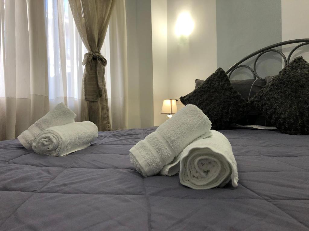 Postel nebo postele na pokoji v ubytování VASILEVI STUDIOS