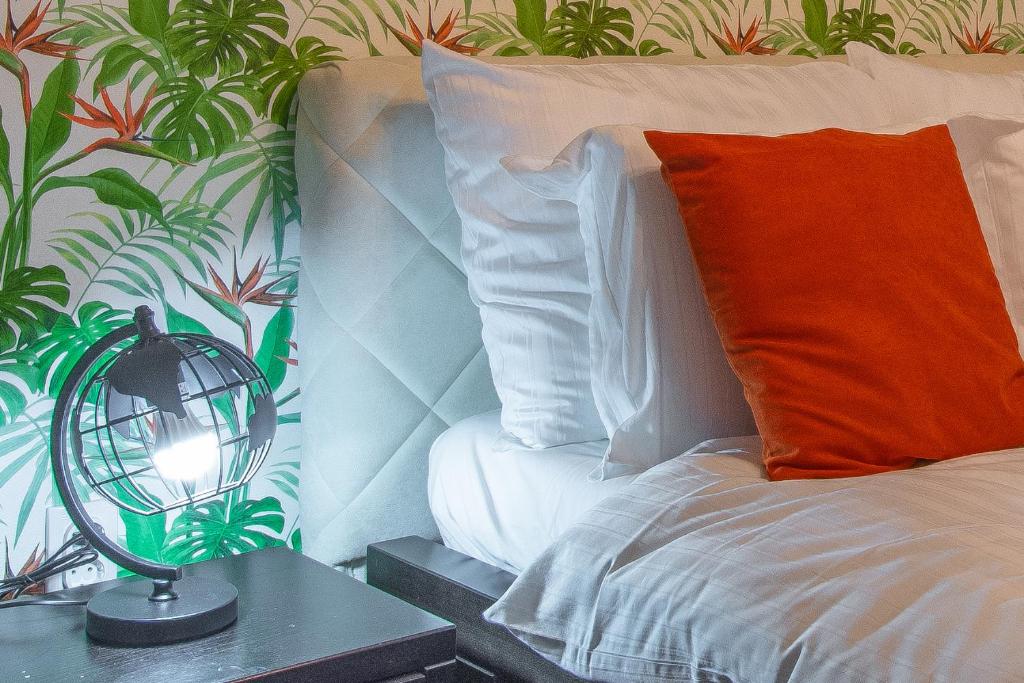 Postel nebo postele na pokoji v ubytování Apartmani Maximilian