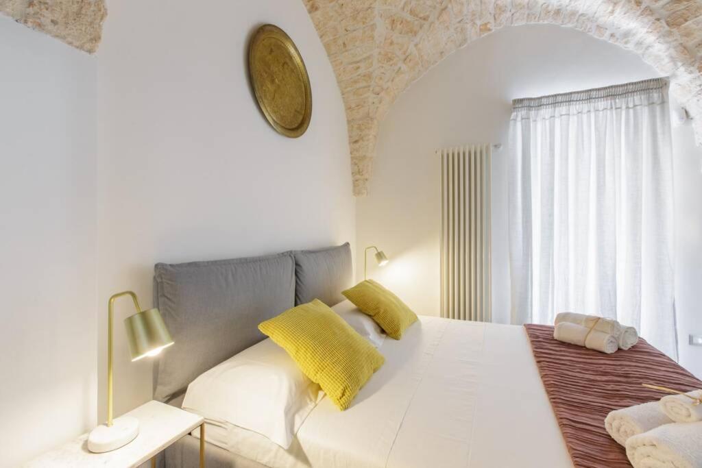 A bed or beds in a room at TORRE BIANCA VISTA MARE