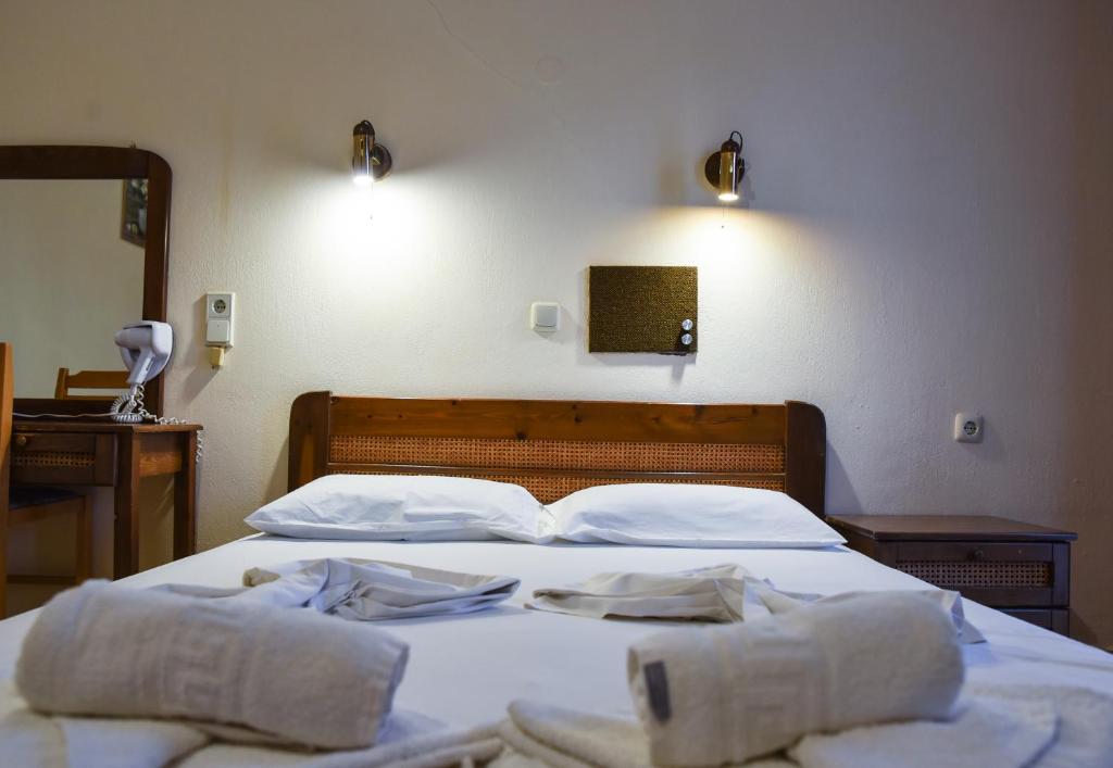 Postel nebo postele na pokoji v ubytování Hotel Coral