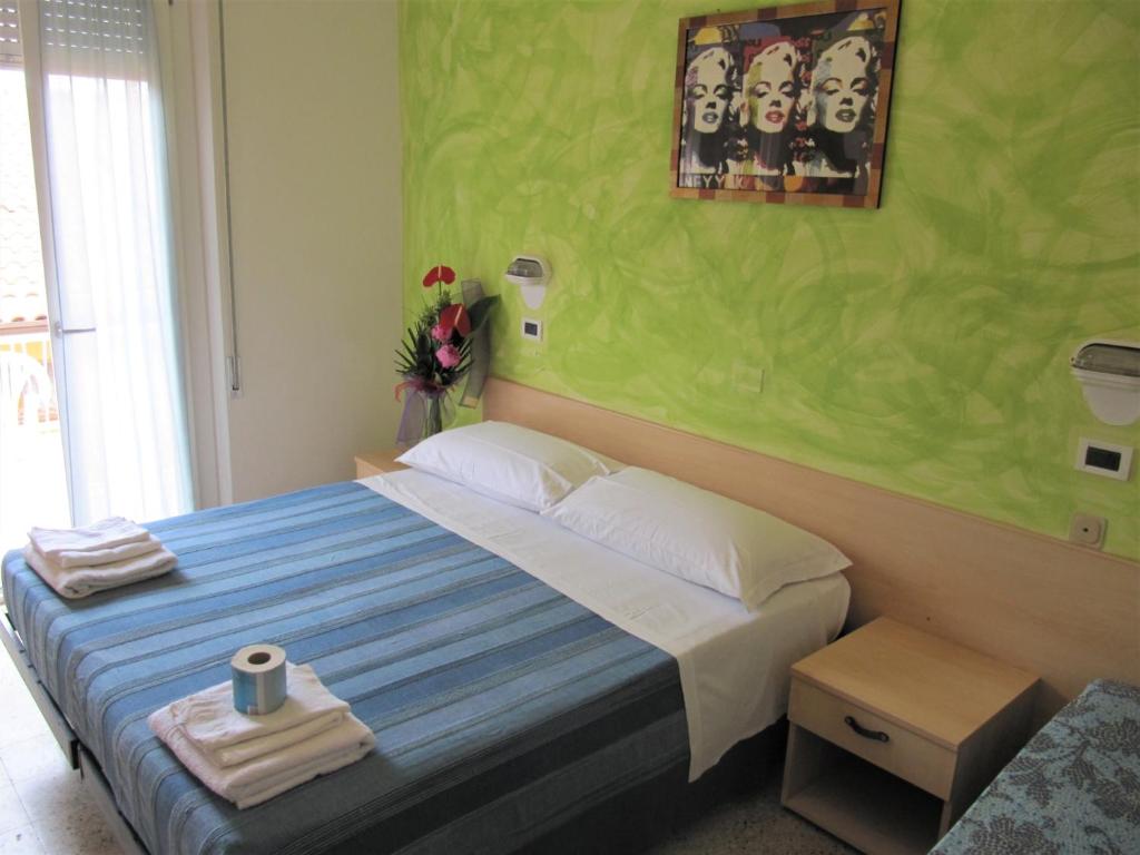 Postel nebo postele na pokoji v ubytování Hotel Villa Elia